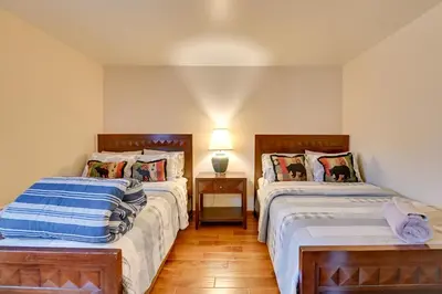 a bedroom with two beds and a table with a lamp at Less Than 1 Mi to Hunter Mtn Skiing Family-Friendly Stay! in Lanesville