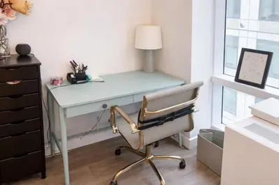 a desk with a chair next to a window at Stylish Downtown Brooklyn Apartment Near Subway & Manhattan in Brooklyn