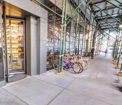 a group of bikes parked inside of a building at Stylish Downtown Brooklyn Apartment Near Subway & Manhattan in Brooklyn