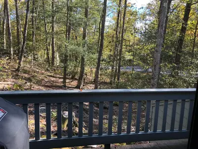 a balcony with a view of the woods at Lakeridge Litchfield townhouse pool tennis skiing in Torrington