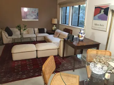 a living room with a couch and a table at Lakeridge Litchfield townhouse pool tennis skiing in Torrington