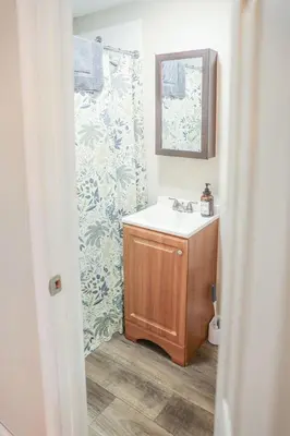 a bathroom with a sink and a mirror at Modern Cozy Studio in East Windsor