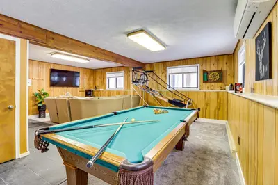a pool table in a room with wooden walls at Scenic Views! Clifton Twp Chalet with Fire Pit, Deck in Gouldsboro