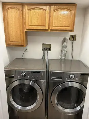 a kitchen with a washer and a dryer at 1BR Apartment - Unit A - With Parking and 10min Walk to NYC Train Station in Mount Vernon