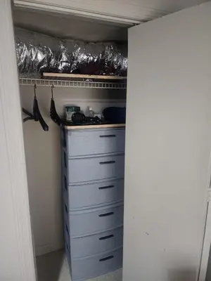 a closet with a bunch of drawers and a shelf at Bridgeport East Main in Bridgeport