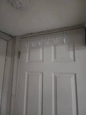 a white closet with a door and a window at Bridgeport East Main in Bridgeport