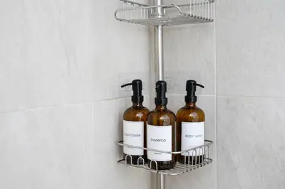 a rack with three bottles of wine on a wall at Family River Valley Retreat with Fireplace in Sparrow Bush