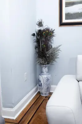 a blue and white vase with a plant in it at Heavenly Retreat Luxury 3 Bedrooms 1 Bathroom in East Orange