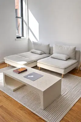 a living room with a couch and a coffee table at Elegant NYC Apartment with Designer Touches in New York