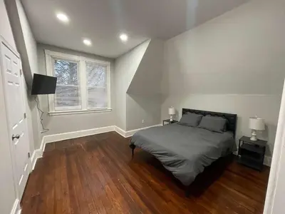 a bedroom with a bed and a window at Apartment in Middletown-Wesleyan 301 in Middletown