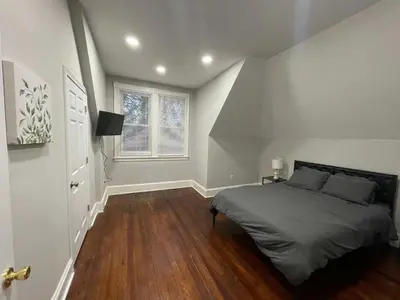 a bedroom with a bed and a window at Apartment in Middletown-Wesleyan 301 in Middletown