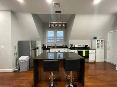 a kitchen with a island in the middle of a room at Apartment in Middletown-Wesleyan 301 in Middletown