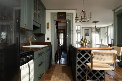 a kitchen with a sink and a counter top at The Mulford Alden House in Hudson