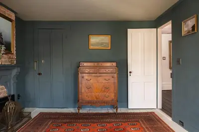 a room with a wooden dresser in a room at The Mulford Alden House in Hudson
