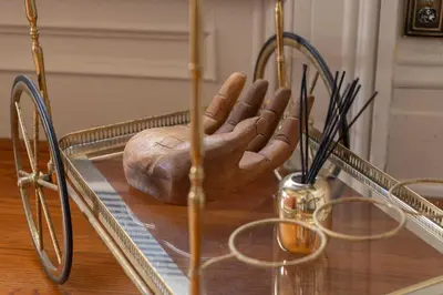 a statue of a hand on top of a mirror at The Mulford Alden House in Hudson