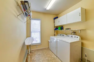 a laundry room with a washer and dryer at Catskills Group Getaway on 50 Scenic Acres! in South Kortright