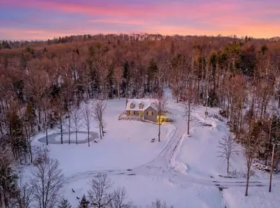 an aerial view of a house in the snow at The Willowbrook Catskills in Athens