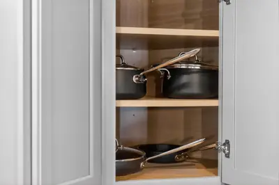 a pantry with pots and pans on shelves at The Willowbrook Catskills in Athens