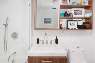 a bathroom with a sink and a toilet and a shower at Union Residence by Rove - Gorgeous Williamsburg Condo in Brooklyn