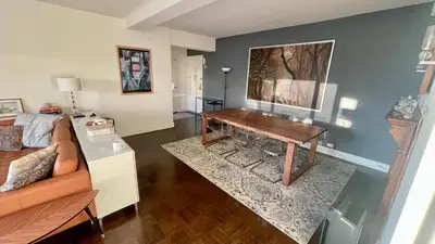 a living room with a desk and a couch at Manhattan Oasis in Peekskill