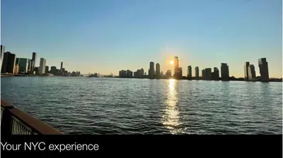 a view of a city from the water with the sun setting at Manhattan Oasis in Peekskill
