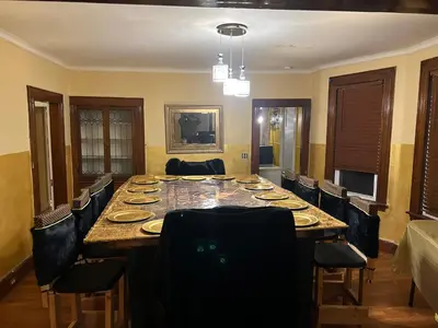 a large dining room table with chairs and a long table at Credo Ok! Party Room in Bridgeport