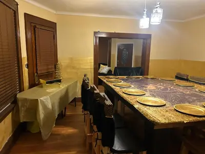 a room with a long table with plates on it at Credo Ok! Party Room in Bridgeport
