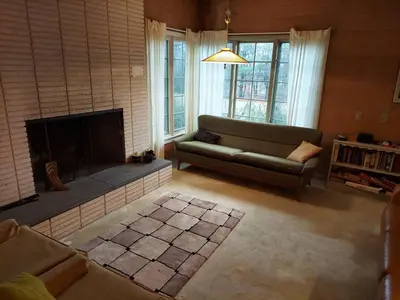 a living room with a couch and a fireplace at Eve's Country Retreat