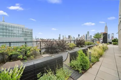 a rooftop garden with a view of the city at Blueground Murray Hill fitness center nr East River NYC-695 in New York