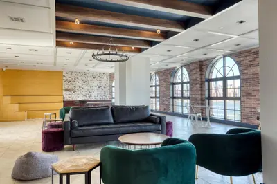 a lobby with a couch and tables and chairs at Blueground Williamsburg rooftop nr East River NYC-1992 in Brooklyn