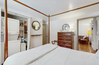 a bedroom with a bed and a dresser at Greer Court Retreat in Wilmington