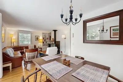a dining room with a table and a living room at Greer Court Retreat in Wilmington