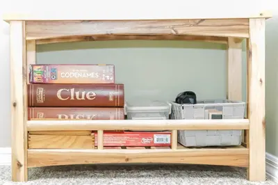 a book shelf filled with books and other items at Cozy Townhouse Near Hunter Mountain in Tannersville