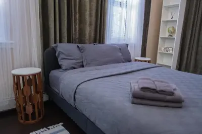a bed with two towels on it in a bedroom at Brand New 3BR 2BA next to Central Park, elevator in New York