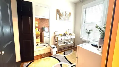 a room with a kitchen with a desk and a window at Sunshine Dream - Deluxe Double Room in Private House - NYC in Sunnyside