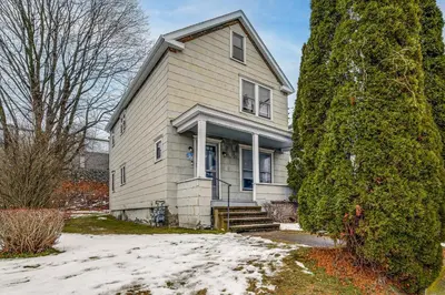 a house with snow on the ground in front of it at Work and Study Binghamton Apt 2 Mi to Downtown in Binghamton