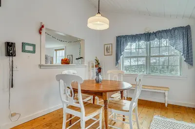 a dining room with a wooden table and chairs at 12 Mi to Bromley Mtn Ski Resort Quiet Hideaway in Manchester Center