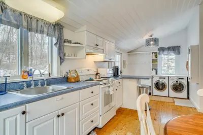 a kitchen with white cabinets and a sink at 12 Mi to Bromley Mtn Ski Resort Quiet Hideaway in Manchester Center
