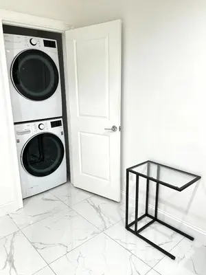 a white laundry room with a washer and dryer at Luxury escape near New York City in Weehawken