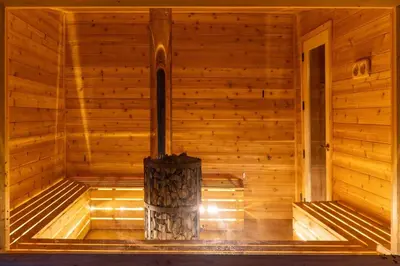 a wooden sauna with a wood stove in it at LaValleyEstates in Long Eddy