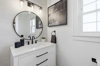 a bathroom with a sink and a mirror at Minutes to Beaches - Home Theater, Couples Retreat in Milford