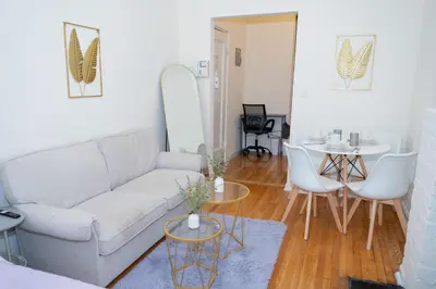 a living room with a couch and a table at Chic12 East Village Apartment Near Union Square Top Dining n Shopping in New York