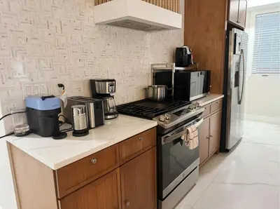 a kitchen with a stove and a microwave at Easy-Access & Quick to NYC, EWR, Dream Mall, Stadium in Jersey City
