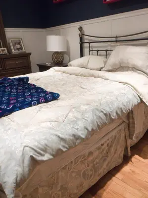 a bedroom with a large bed with white sheets at Lucious Lagrangeville in Lagrangeville