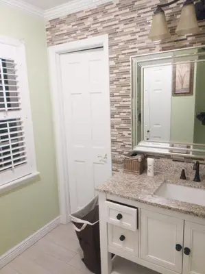 a bathroom with a sink and a mirror at Lucious Lagrangeville in Lagrangeville