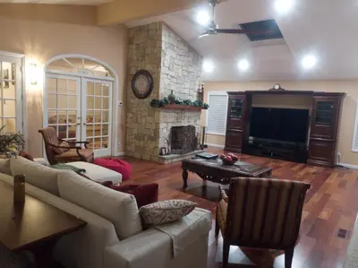 a living room with a couch and a fireplace at Lucious Lagrangeville in Lagrangeville