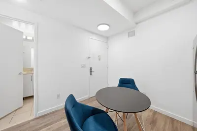 a meeting room with a table and blue chairs at The Aurora in New York