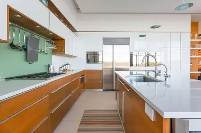 a large kitchen with wooden cabinets and a sink at Extraordinary Private Retreat Near NYC in Highland