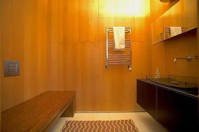 an orange bathroom with a shower and a sink at Extraordinary Private Retreat Near NYC in Highland