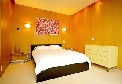 a bedroom with a bed and a painting on the wall at Extraordinary Private Retreat Near NYC in Highland